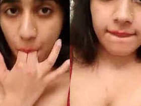 Desi babe in red lingerie teases and pleasures herself on camera