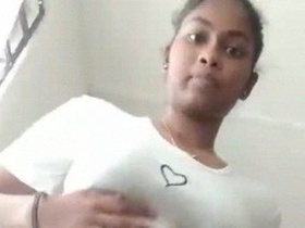 Indian babe teases with her hairy pussy in solo video