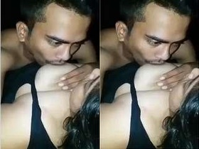 Lover gives oral pleasure to girlfriend's breasts