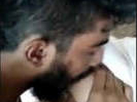 A guy sucks on a girl's breasts in a steamy encounter