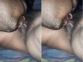 Husband pleasures his wife's pussy in steamy video