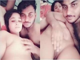 Pretty Desi girl gives a blowjob to her lover's breasts