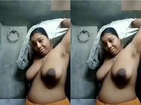 Indian wife flaunts her breasts on camera for her spouse