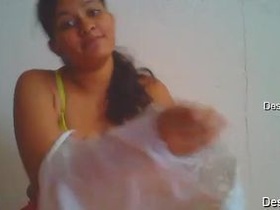 Cute girl with natural breasts dresses up for the camera