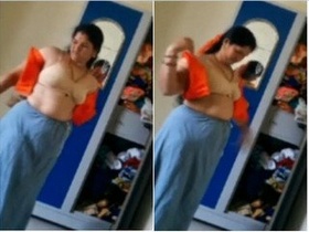 Indian housewife undressing for a steamy solo session