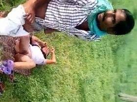 Outdoor sex video featuring a local couple getting caught in the open field