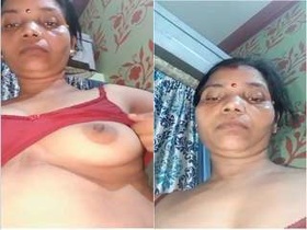 Exclusive video of a horny Desi bhabhi flaunting her boobs and pussy