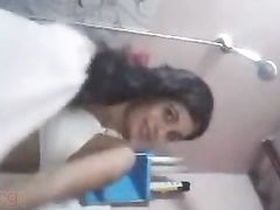 A young and beautiful girl from Chennai records herself while taking a bath