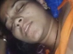 Desi woman pretends to be asleep while being filmed by a man with a camera