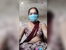 Indian wife wears face mask while exposing her breasts and genitals on camera