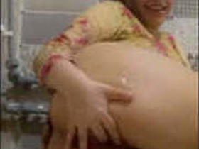 A petite girl masturbating with her fingers and exposing her body