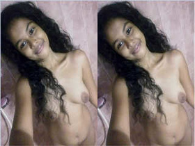 Beautiful woman films herself naked with a camera