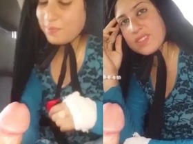 A stunning Pathani girlfriend gives a blowjob in a car, exposing her breasts and pussy