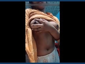 A charming Indian girl flaunts her breasts