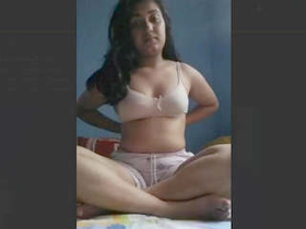 Cute girl pleases herself with her fingers