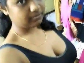 A stunning South Indian girl with big boobs teases her friend in a seductive manner