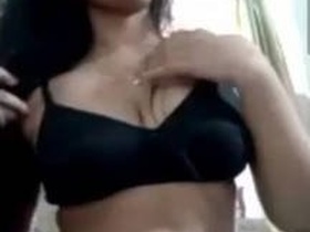Latina girl with a beautiful figure pleasures herself with her fingers