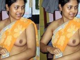 Indian girl with small breasts teases in a tank top