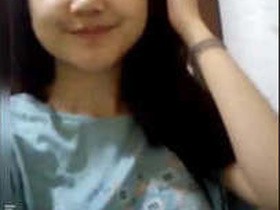 Watch this sexy girl show off her beautiful breasts