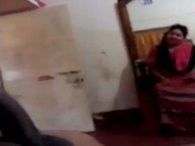 Mature Habhi eagerly sucks big dick in a room full of others