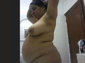 MILF aunty flaunts her large breasts