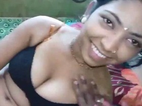 Enjoy a naughty Indian girl with a trimmed pussy and sparkly tits