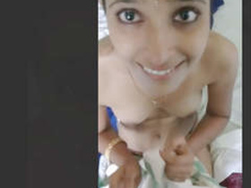 A young Indian woman performs a sensual blowjob