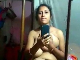 Indian girl with large breasts bares all and pleasures herself