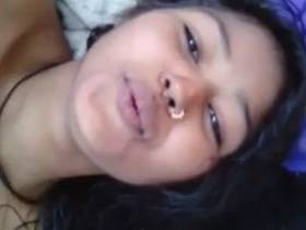 Neha, a sexy Indian girl, pleasures herself with her fingers in a selfie video