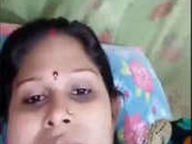 Aunty in a revealing dress gets naughty in the bedroom