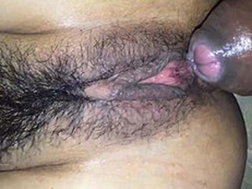 Close-up of a hairy pussy getting fucked in desi video