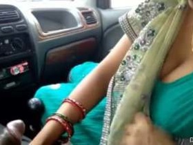 Mature Indian woman gives a blowjob in a car