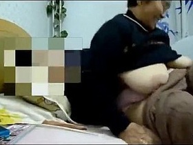 Chinese granny gets naughty in explicit video