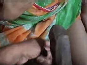 Indian bhabhi gives a handjob and gets a cumshot on her breasts