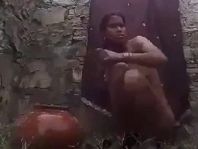 Village Bhabhi takes a bath in the open air