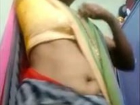 Aunty Desi's sexy saree opens up in a village porn video