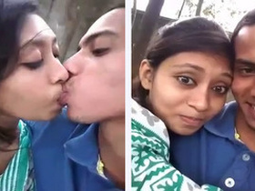 College-aged desi babe kisses her partner in the park