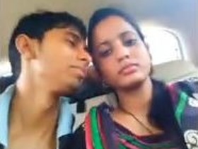 Shy Indian girlfriend kisses her partner in the car
