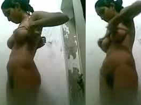 Naked Indian girl in the bathroom with exposed breasts