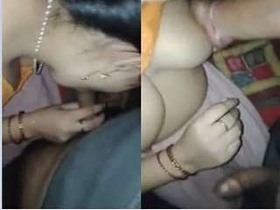 Exclusive video of a village wife giving a blowjob and showing off her boobs