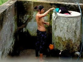 Desi girl bathing behind the door in part two