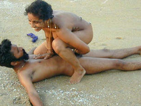 A South Asian couple enjoys themselves on the beach in a leaked premium video
