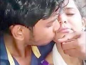 Desi couple kissing in a village setting