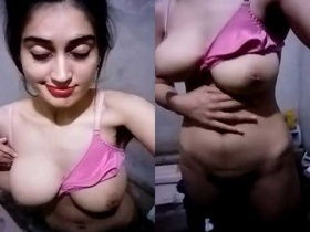 Pakistani babe shows off her big tits and masturbates in the bathroom
