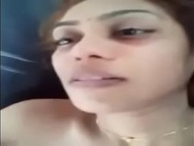 Indian babe with big tits gives a blowjob in a car