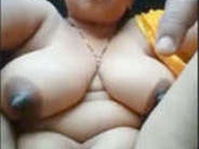 Mature village woman unveils her breasts and private parts